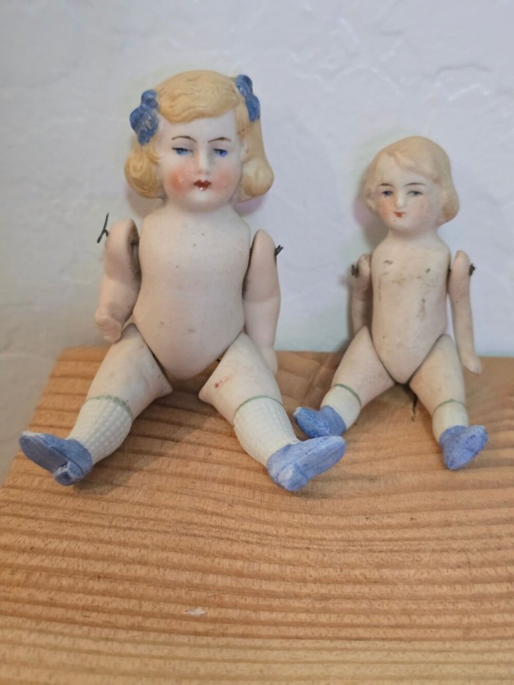 2 Antique German Bisque Mignonette Jointed Dolls Blue Bow Pudgy Tummy